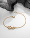Kit Heath Golden Infinity Bracelet